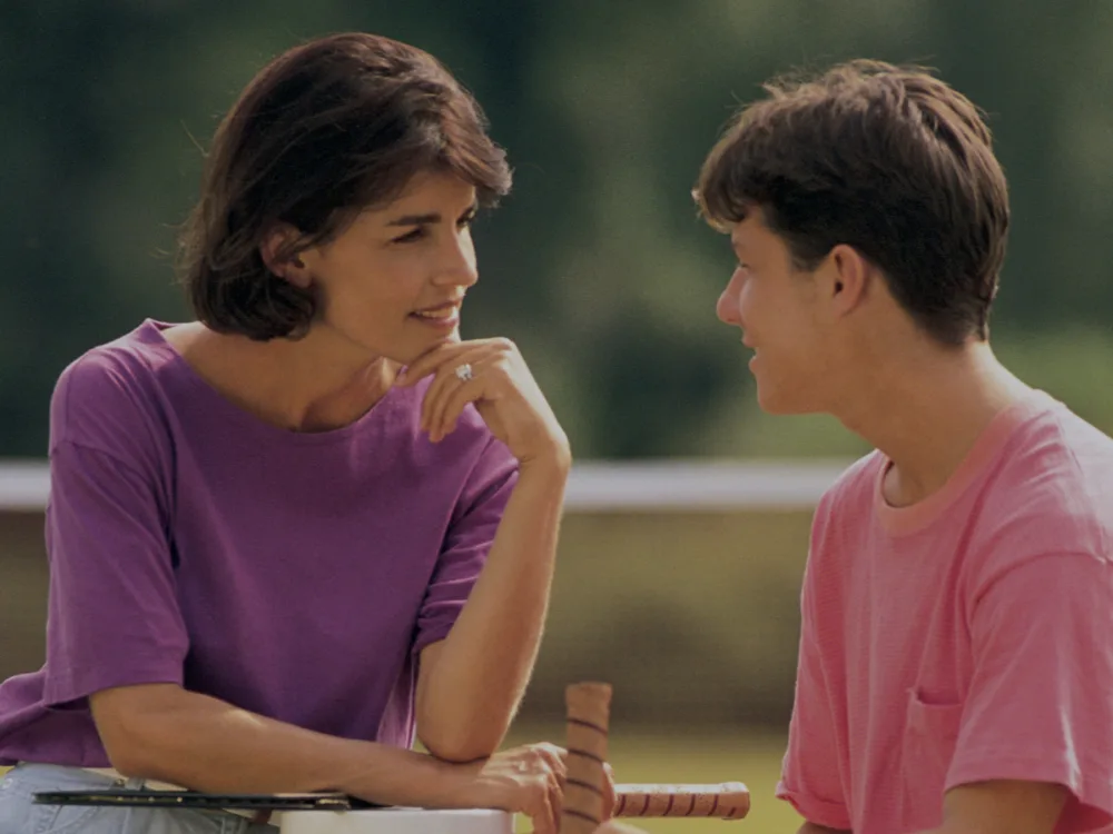 Mother and her son talking outdoors