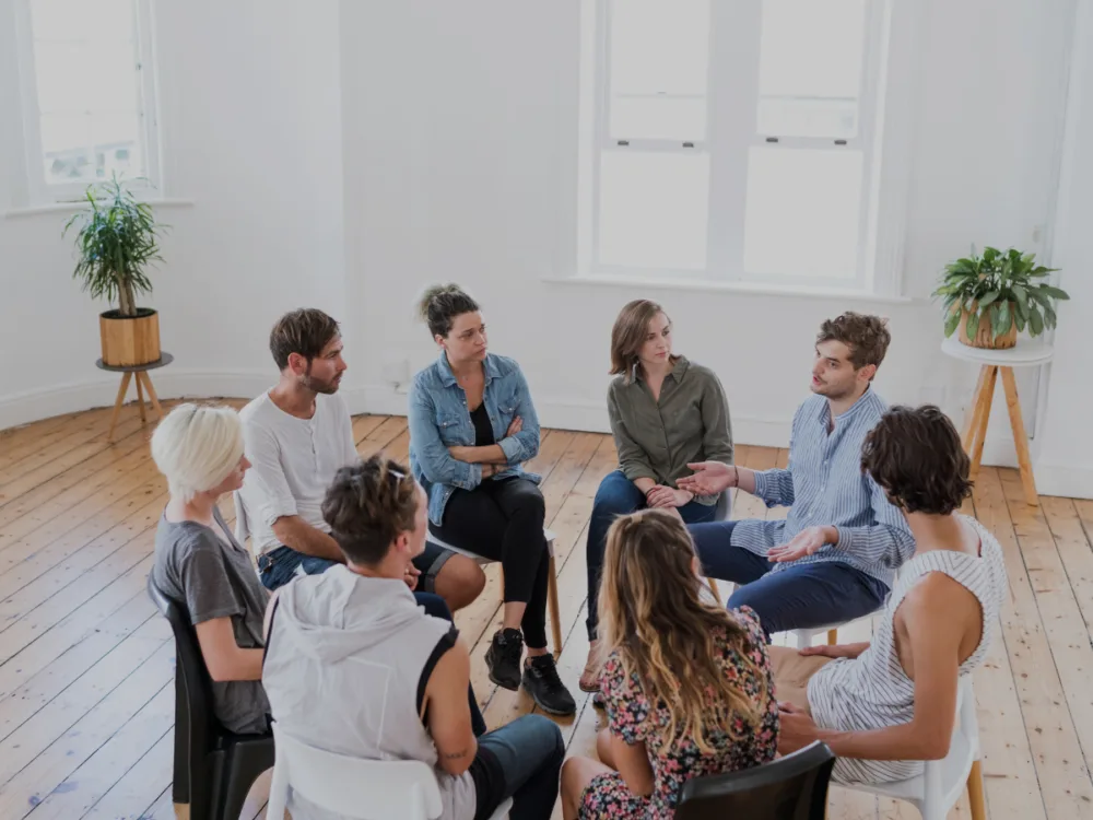Group members listening attentively during a discussion.